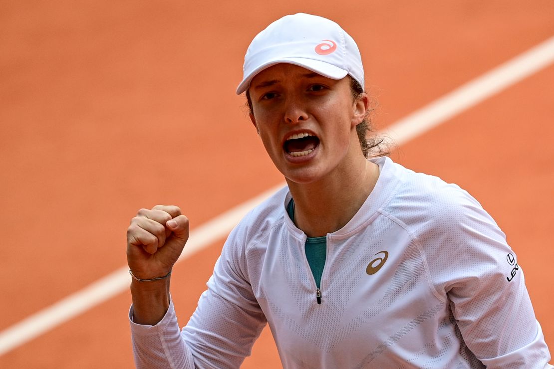 Swiatek celebrates in her French Open semifinal against Nadia Podoroska.