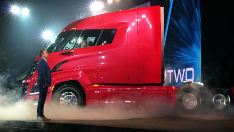 Former Nikola executive chairman Trevor Milton stands next to a truck at Nikola World 2019.