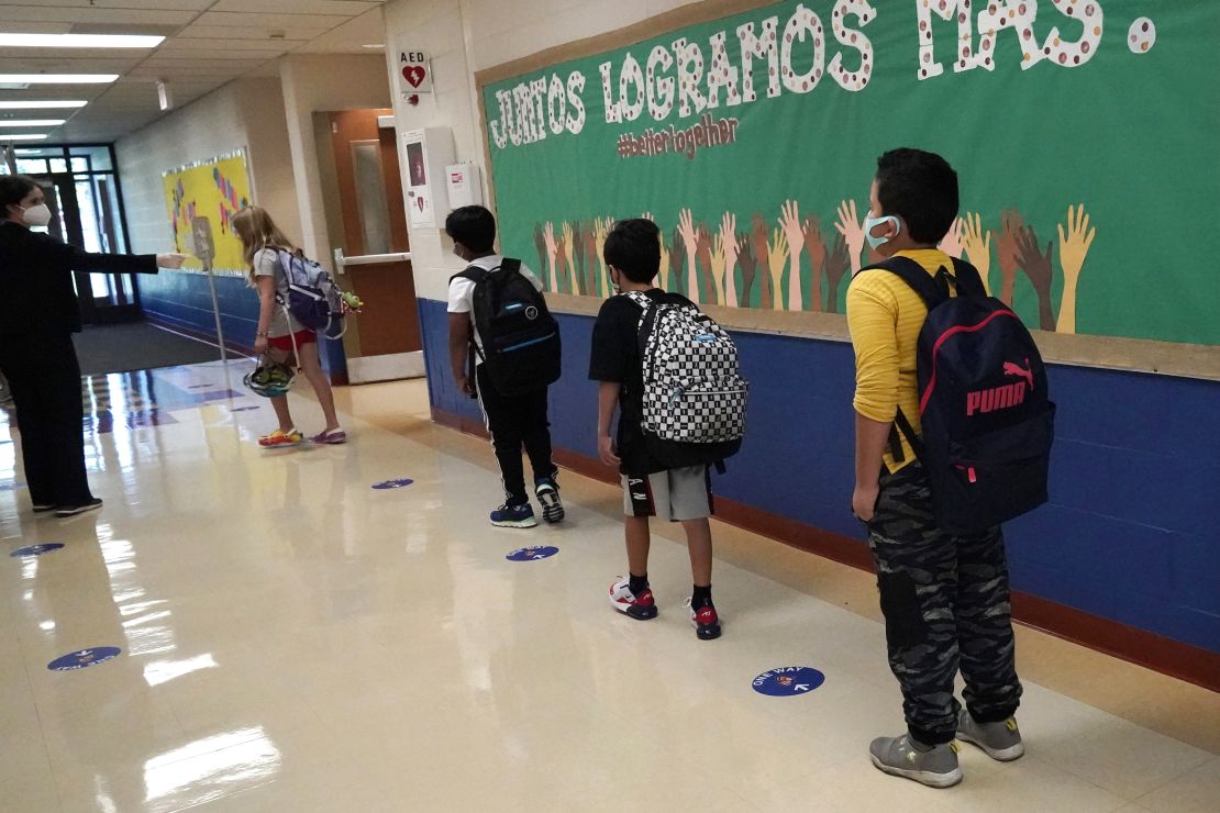 Students keep a social distance from each other in a school in Highwood, Illinois -- practicing one key mitigation measure. 