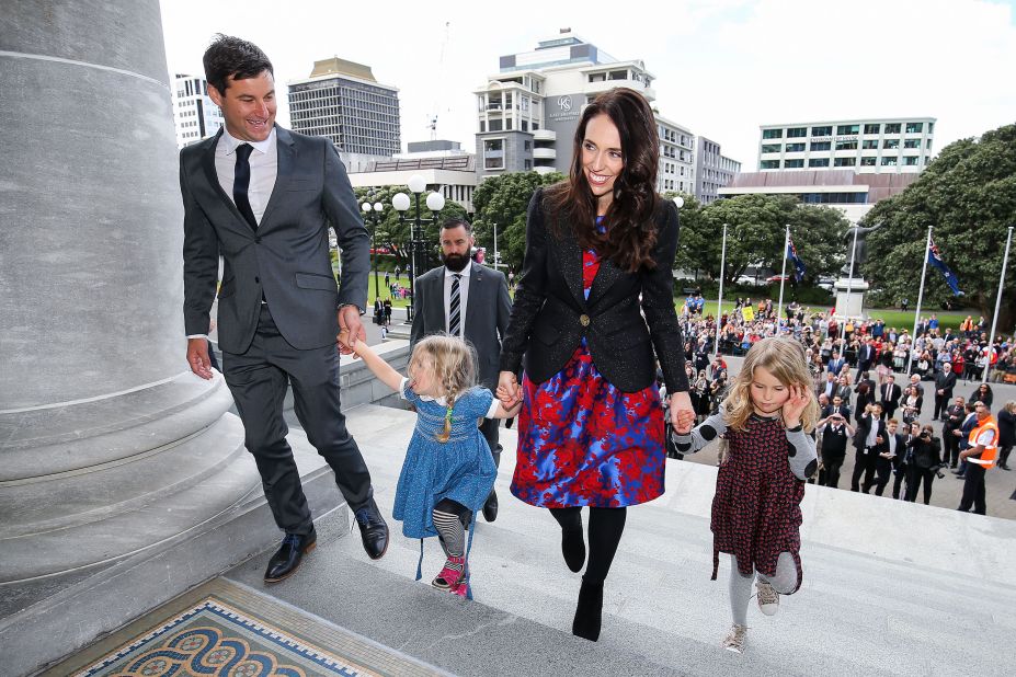 Prime Minister Jacinda Ardern, her partner Clarke Gayford, and Gayford's nieces Rosie and Nina Cowan arrive at Parliament after a swearing-in ceremony at Government House on October 26, 2017.