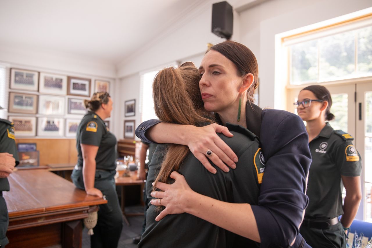 Jacinda Ardern hugs a first responder from the St John's ambulance team that helped those injured in the White Island volcano eruption on December 9, 2019. 