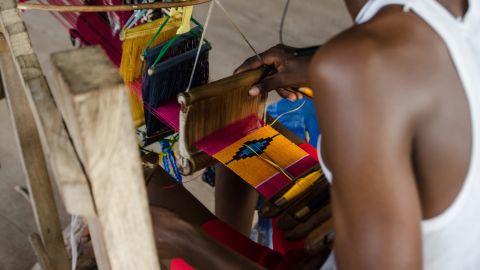 While it's often mass-produced, there are many folk weavers around the country who make kente cloths by hand.