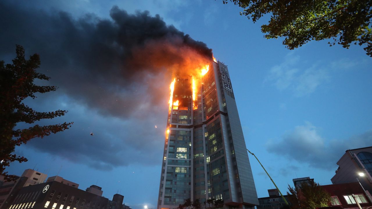 An apartment building is engulfed in a fire in Ulsan, South Korea, on October 9.