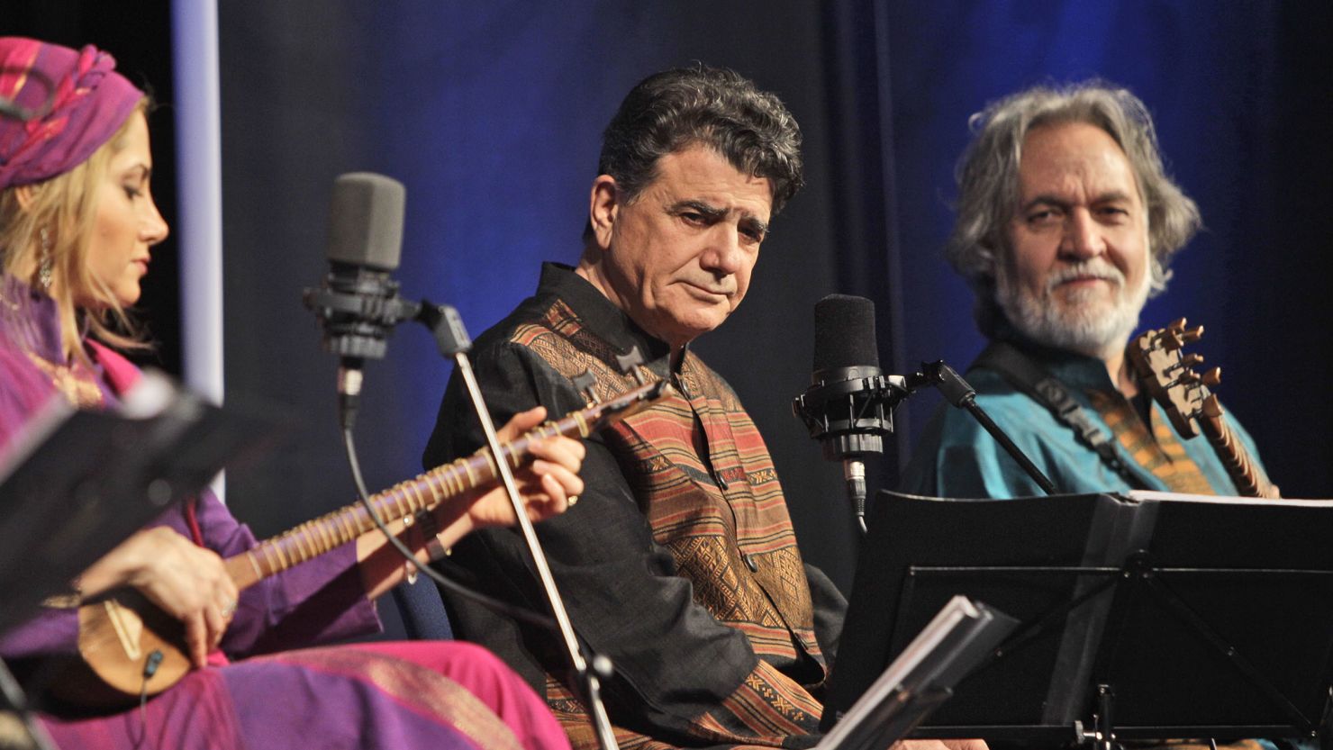 Iran's greatest master of Persian classical music Mohammad Reza Shajarian, middle, performs with Mojgan Shajarian, 2nd left, and Majid Derakhshani composer, 2nd right, during a concert with Shahnaz Ensemble band in Dubai, United Arab Emirates, Thursday, Feb. 17, 2011. 