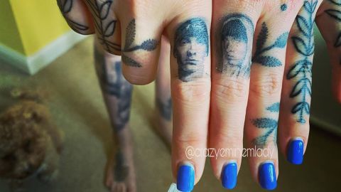 Along with portraits, Patterson has several lyrics and symbols associated with the rapper tattoed on her body.