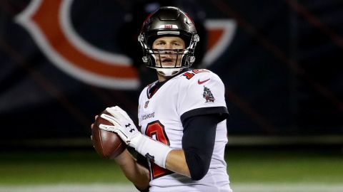 Brady warms up before the game against the Bears.