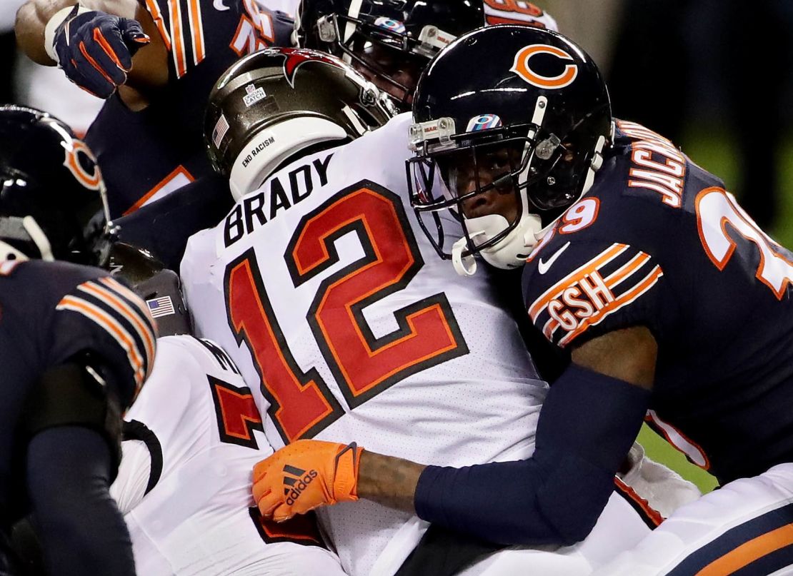 Brady is tackled by Eddie Jackson of the Chicago Bears.