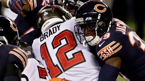 Brady is tackled by Eddie Jackson of the Chicago Bears.