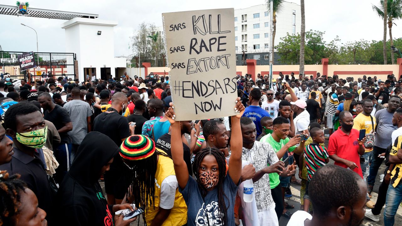 A girl carries placard reading "Special Ant-Robbery Squad (SARS) Kill, SARS Rape, SARS Extort, End SARS Now" at a demonstration to call for the scrapping of the controversial police unit, on October 9, 2020. 