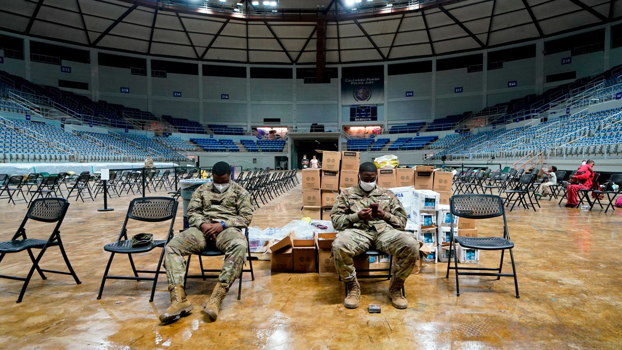 Members of the Louisiana National Guard prepare beds in a shelter ahead of Hurricane Delta on October 9 in Lake Charles, Louisiana.