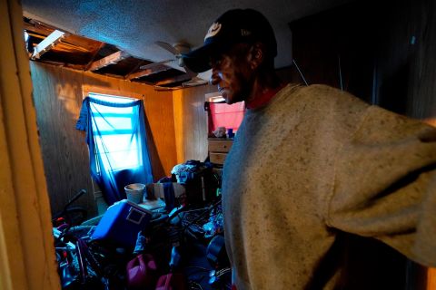 Earnst Jack looks at damage to his home after it was hit by Hurricane Laura ahead of the arrival of Hurricane Delta on October 9 in Lake Charles, Louisiana.