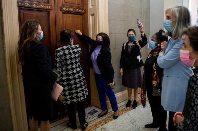 From left, US Reps. Veronica Escobar, Jackie Speier, Norma Torres, Deb Haaland, Sheila Jackson Lee, Katherine Clark and Jan Schakowsky, along with members of the Democratic Women's Caucus, deliver a letter to Senate Majority Leader Mitch McConnell's office on October 2. They were calling for the nomination process to be stopped until after the presidential inauguration.