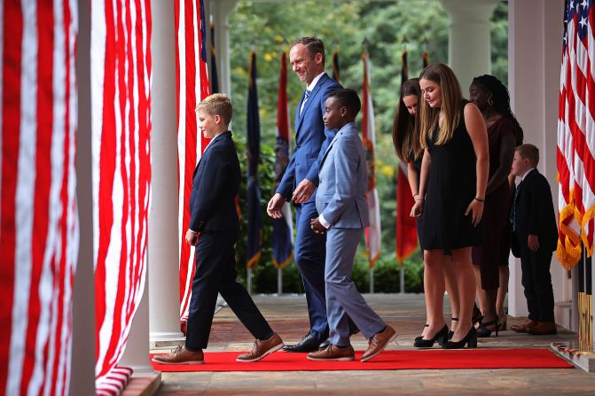 Barrett and her family walk into the Rose Garden for the nomination ceremony.