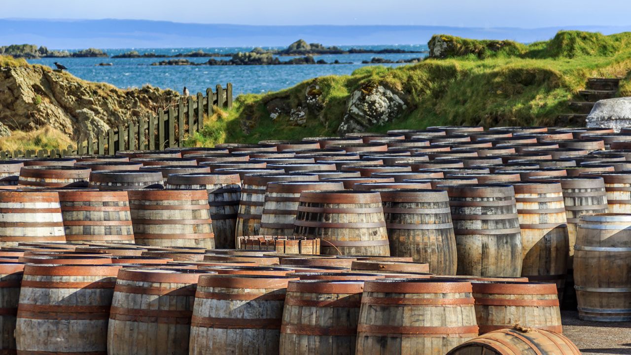 Scotch whisky barrels lined up seaside on the Island of Islay, Scotland UK