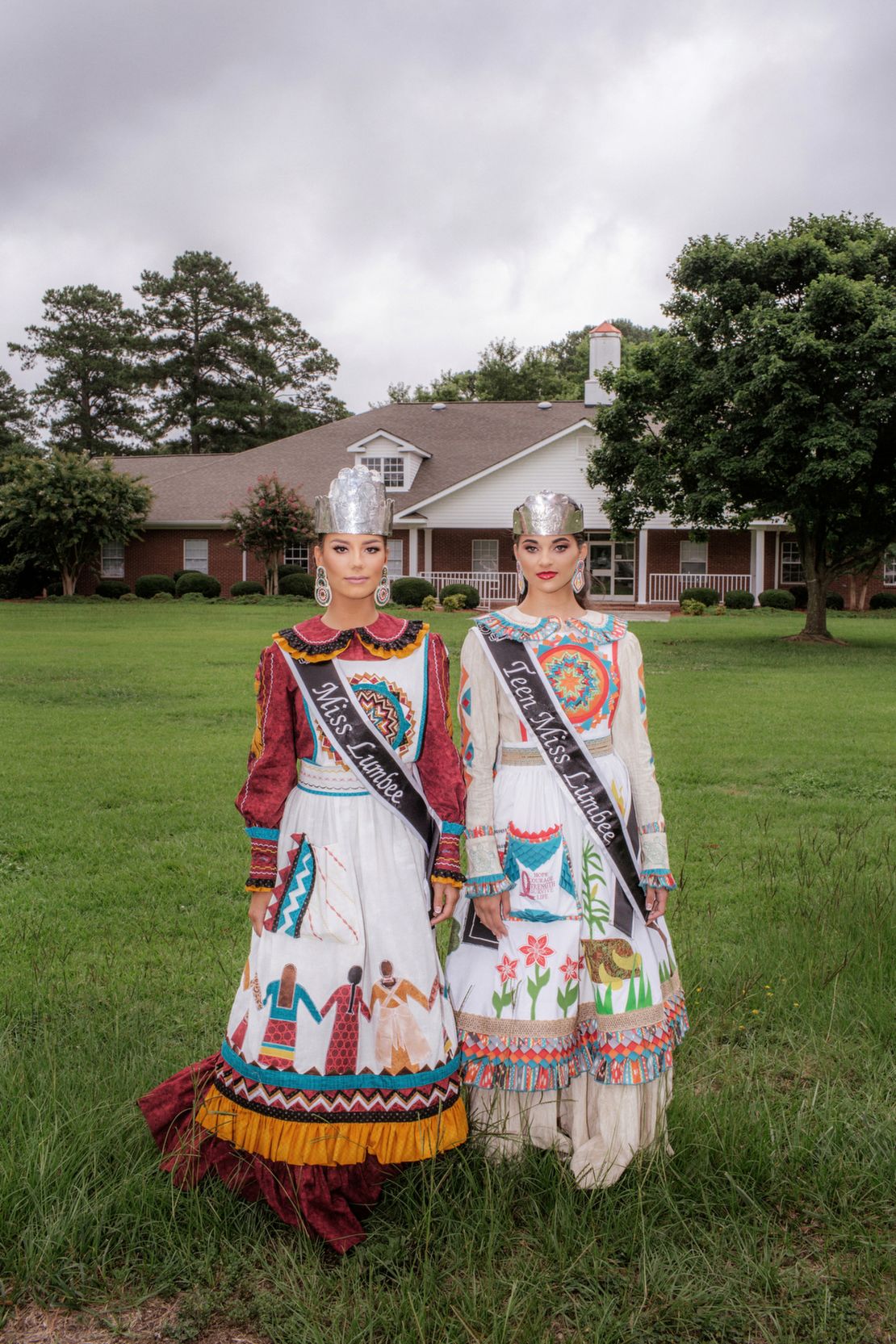 Kerigahn Jacobs, Miss Teen Lumbee 2018, and Lyndsey Locklear, Miss Lumbee 2018, wearing their native regalia.