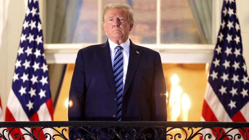 WASHINGTON, DC - OCTOBER 05: U.S. President Donald Trump stands on the Truman Balcony after returning to the White House from Walter Reed National Military Medical Center on October 05, 2020 in Washington, DC. Trump spent three days hospitalized for coronavirus. (Photo by Win McNamee/Getty Images)