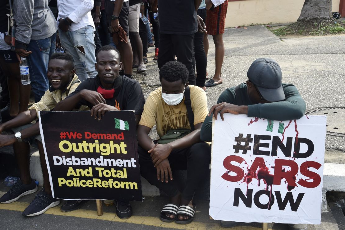 Young men take part in a demonstration calling for the scrapping of the controversial Special Anti-Robbery Squad, or SARS police unit, in Ikeja, on October 8.