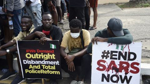 Young men take part in a demonstration calling for the scrapping of the controversial Special Anti-Robbery Squad, or SARS police unit, in Ikeja, on October 8.