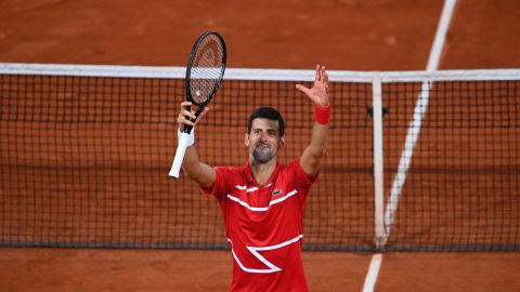 Djokovic celebrates his five-set victory over Tsitsipas.