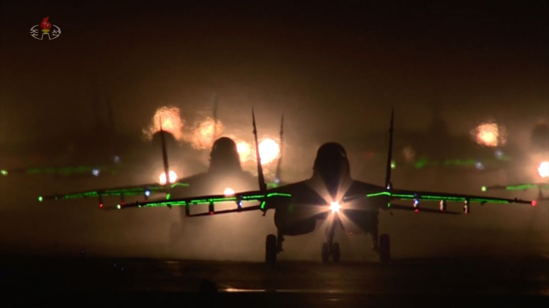 North Korean warplanes prepare to take off and fly over the military parade in Pyongyang on Saturday.