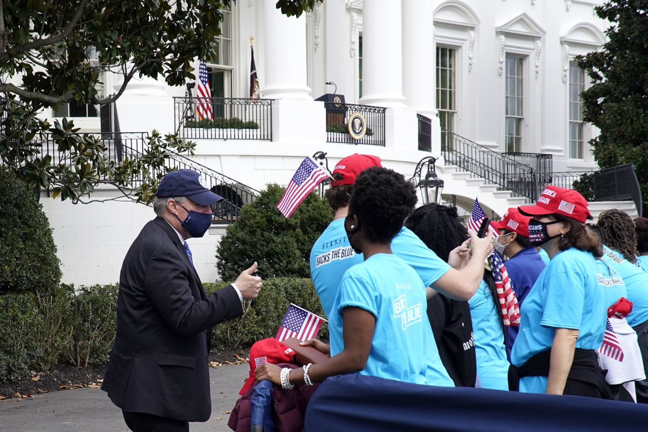 White House chief of staff Mark Meadows speaks to President Trump supporters gathered on the South Lawn of the White House ahead of the President's speech on Saturday. 