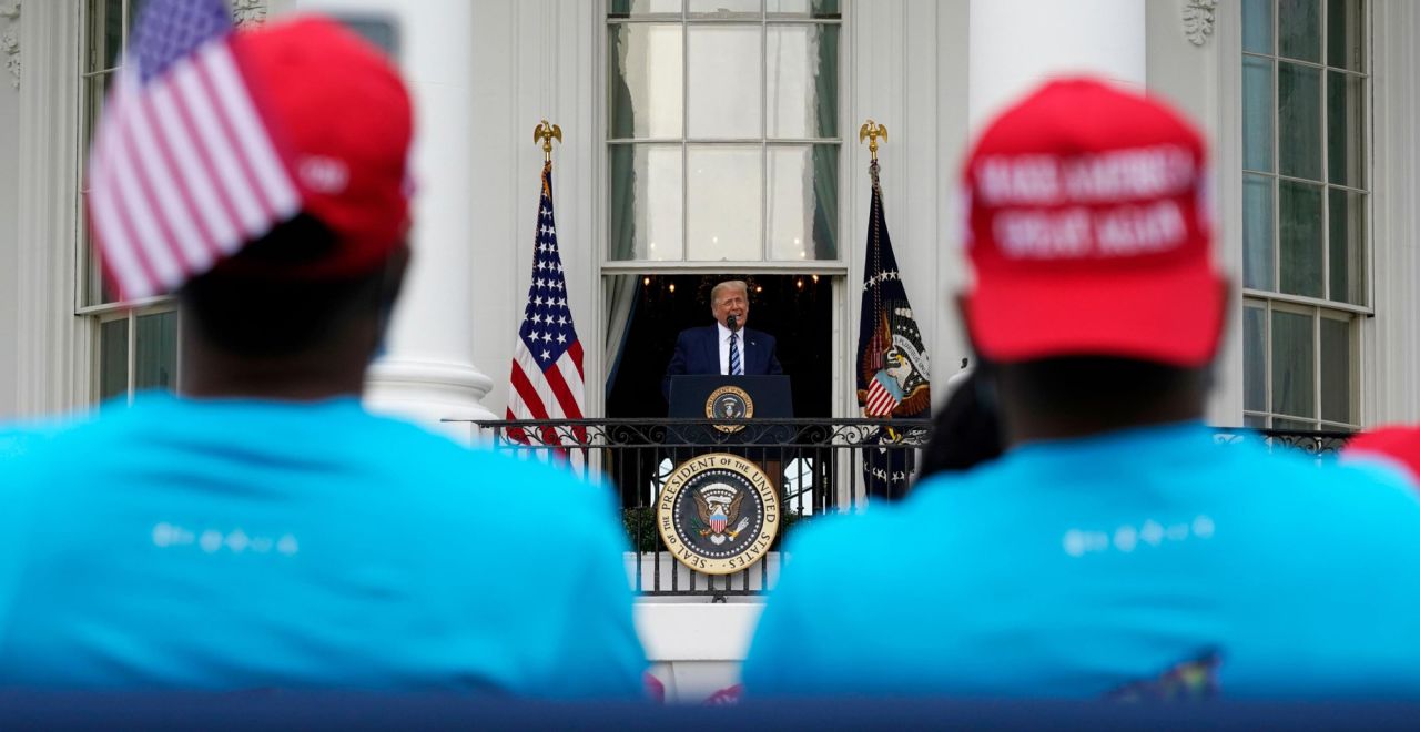 President Donald Trump speaks from the Blue Room Balcony of the White House to a crowd of supporters, Saturday, Oct. 10, 2020, in Washington.