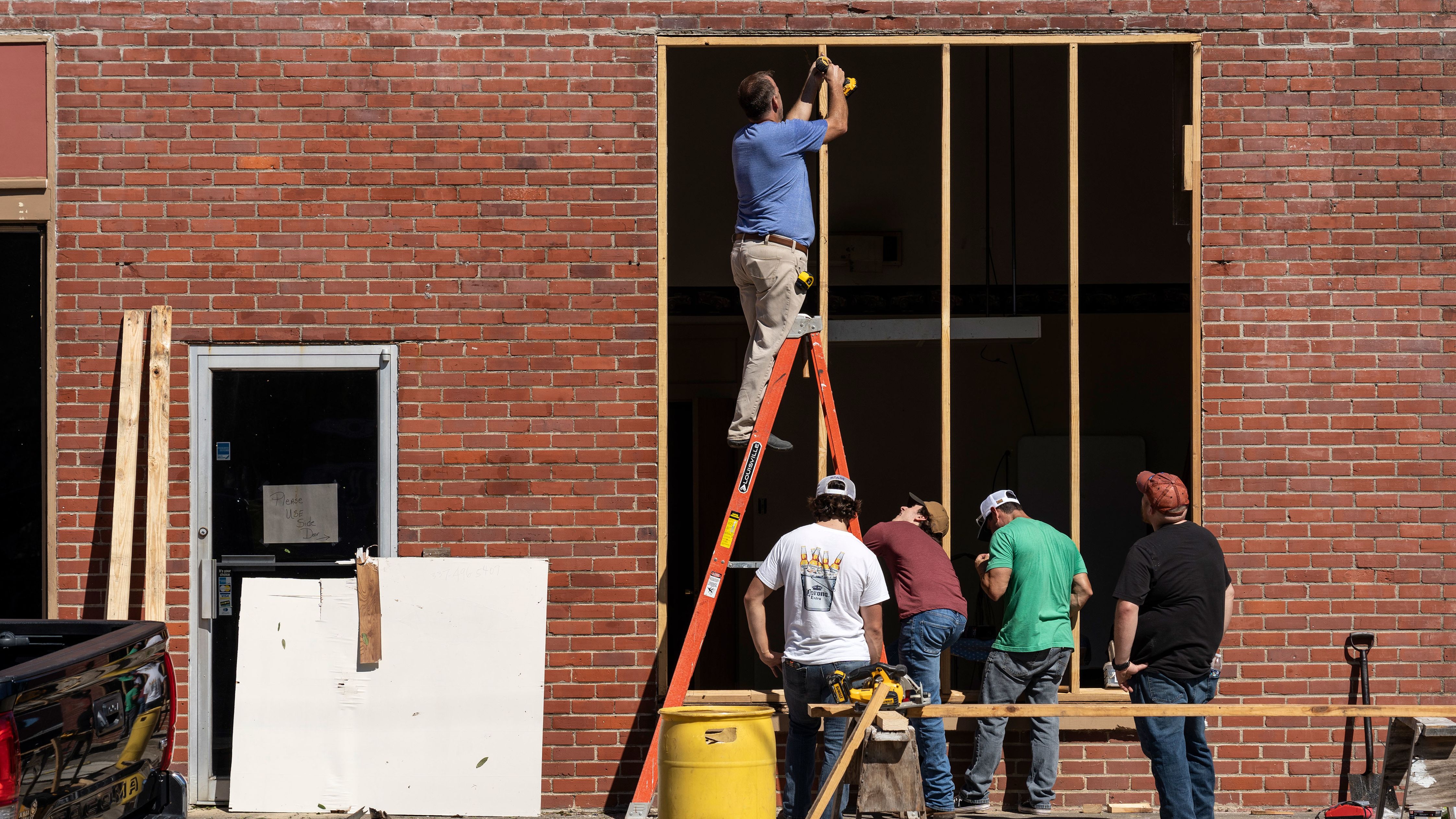 Residents of Jennings, Louisiana, were already working on October 10 to repair windows damaged by Hurricane Delta.