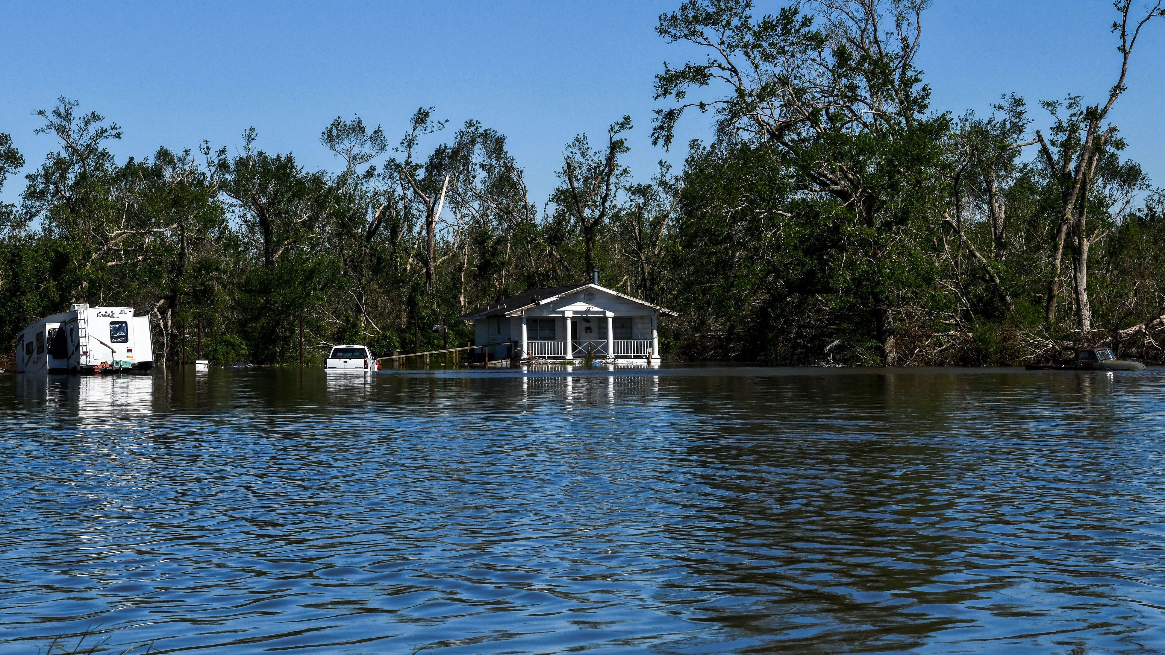 Houses near Lake Charles, Louisiana, are surrounded by flood waters on Saturday, October 10.