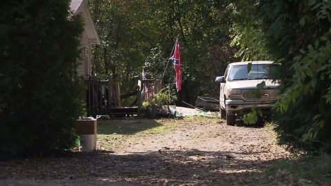 The truck next to the house flying the Confederate flag had an upside-down Stars and Stripes on its antenna.