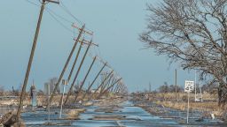 Mandatory Credit: Photo by TANNEN MAURY/EPA-EFE/Shutterstock (10949237k)Utility poles lean along a flooded road in Cameron, Louisiana, USA, 10 October 2020.  Hurricane Delta came ashore nearby causing widespread damage and power outages to hundreds of thousands of people in Louisiana, Texas and Mississippi just six weeks after Hurricane Laura caused wiidespread damage.Hurricane Delta aftermath, Cameron, USA - 10 Oct 2020