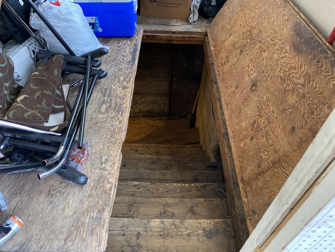 The FBI called this a trap door, but Vac Shack owner Briant Titus told CNN it was just the way to his basement.