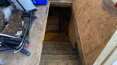 The FBI called this a trap door, but Vac Shack owner Briant Titus told CNN it was just the way to his basement.