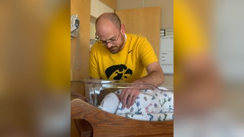 Jimmy Cate, shown with newborn Beric, was back at work one week after his son's birth.