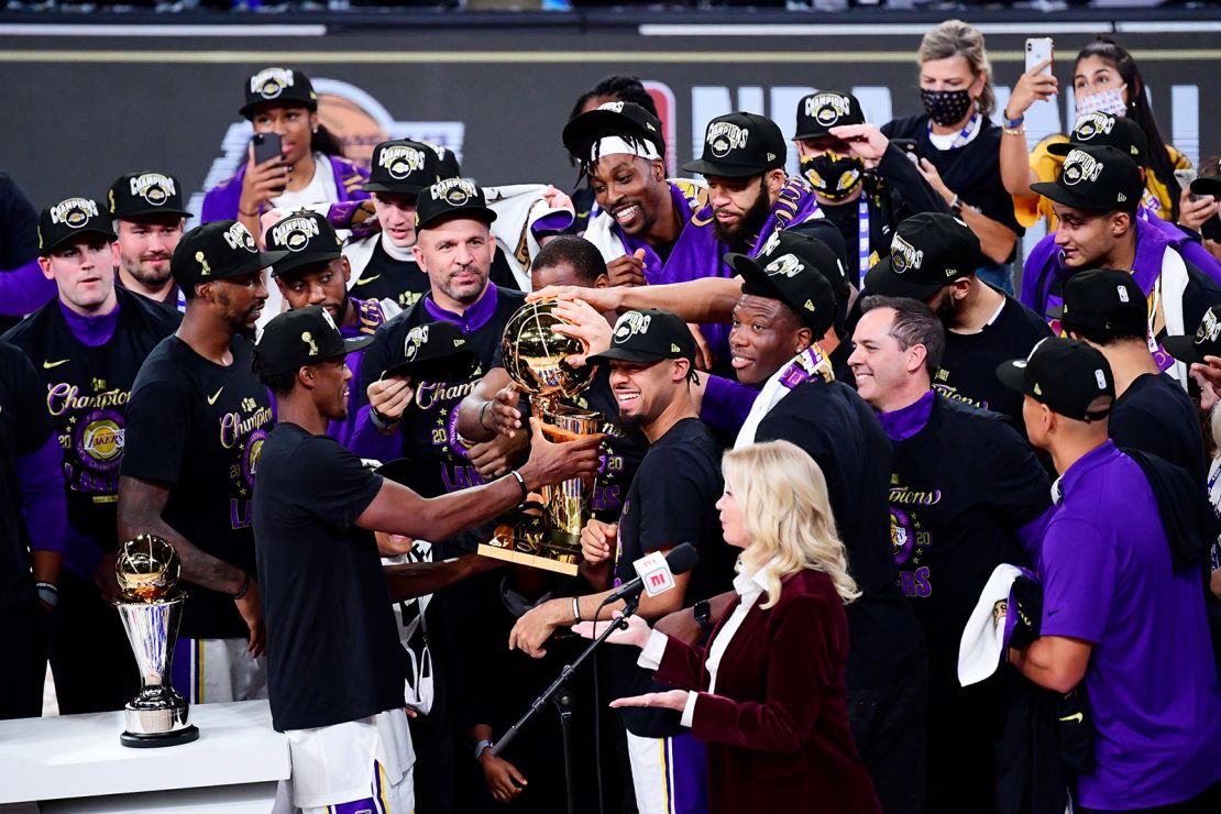The Lakers celebrate with the trophy after winning the 2020 NBA Finals in Lake Buena Vista, Florida.