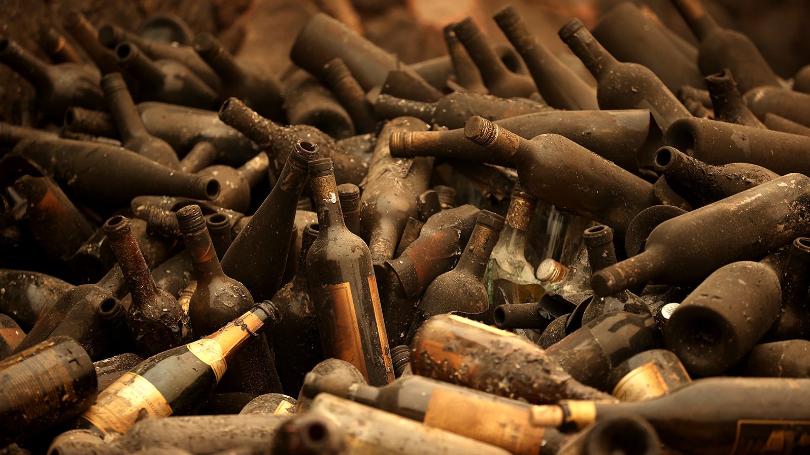 Burned bottles of wine sit in a pile at the Castello di Amorosa winery, which was destroyed by the Glass Fire in Calistoga, California, on October 1, 2020. Wildfires have damaged and <a href="https://www.cnn.com/2020/10/11/us/california-wildfires-wineries/index.html" target="_blank">destroyed dozens of the region's famed wineries,</a> many of them family-owned businesses.
