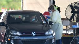 A man performs a self-swab at a drive-through COVID-19 testing site at Eastern Florida State College on October 9, 2020 in Palm Bay, Florida. The Florida Department of Health reports that COVID-19 cases, deaths, and hospitalizations are on the rise while U.S President Donald Trump plans to hold a rally in Sanford, Florida after contracting the disease.  (Photo by Paul Hennessy/NurPhoto  via Getty Images)