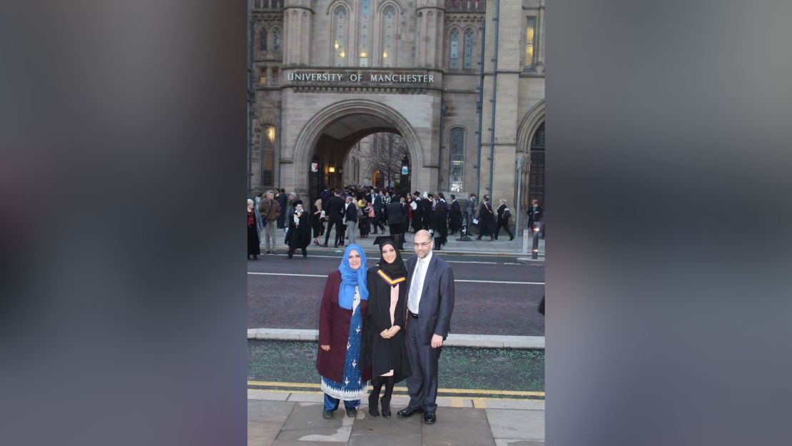 Rabnawaz and Zaida Akbar stand alongside Asma at her university graduation in Manchester, England in December 2016.