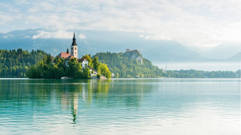 <strong>6. Lake Bled, Slovenia:</strong> Lake Bled, silhouetted against the backdrop of the Julian Alps, looks like it's been plucked straight out of a fairy tale. 