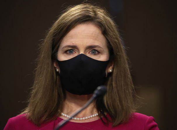 Barrett wears a mask as she arrives at the Hart Senate Office Building on October 12. <a  target="_blank">Barrett kept her mask on</a> as she listened to senators kick off the hearing.