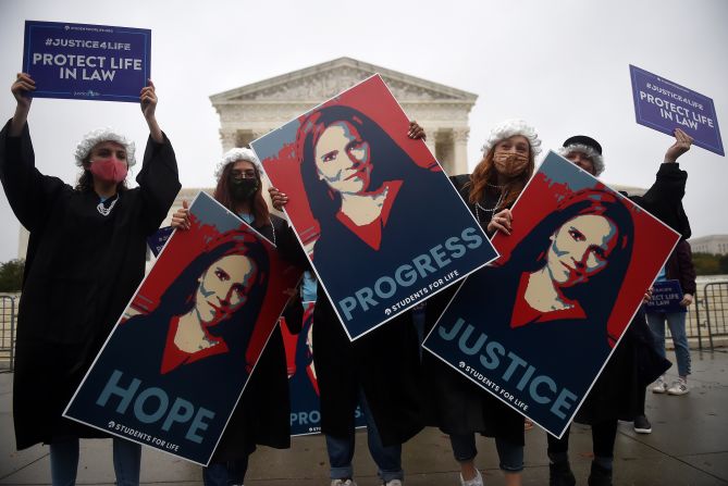 People show their support for Barrett in front of the Supreme Court on October 12.