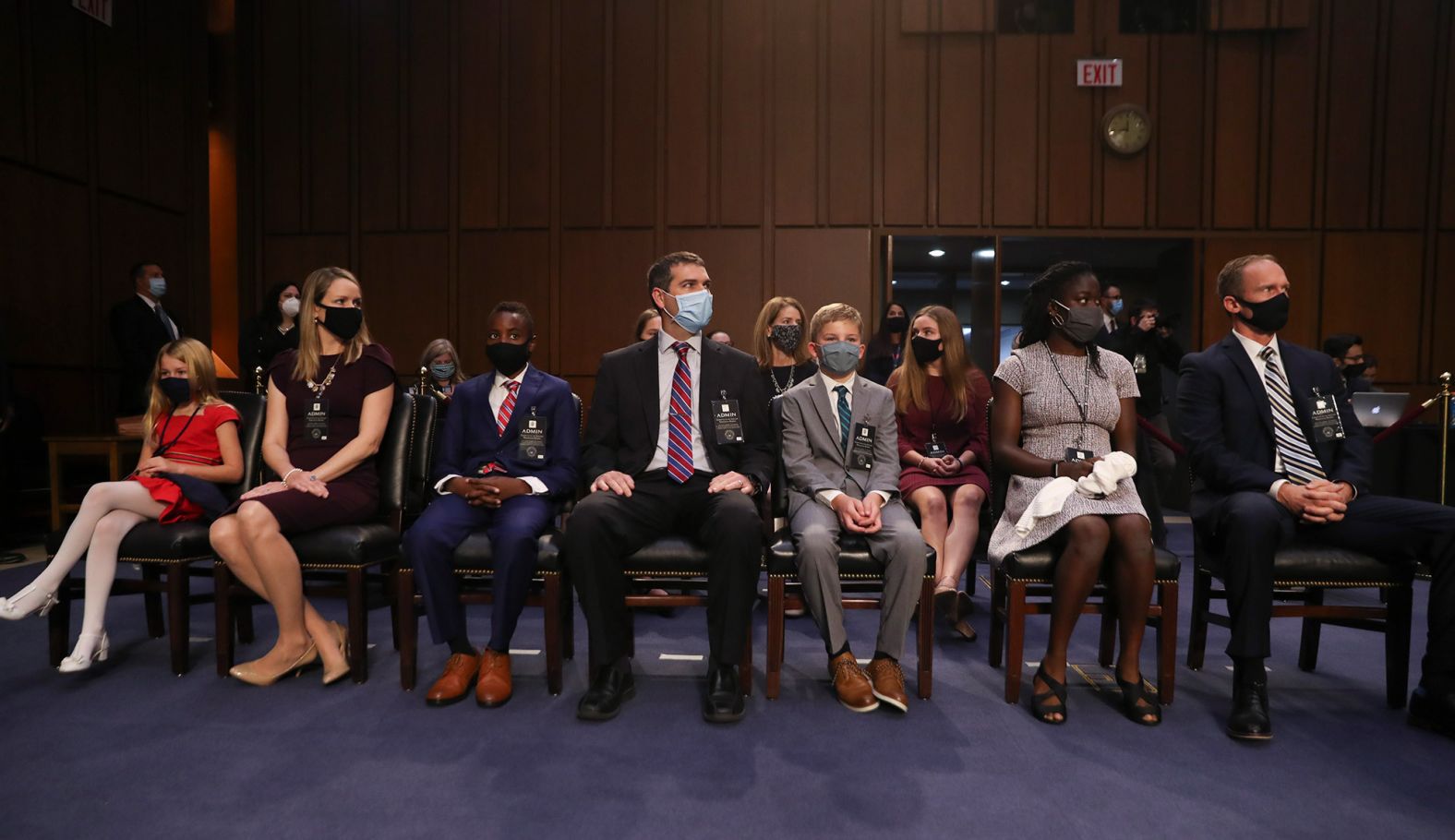 Barrett's husband, Jesse, sits at right along with some of the family's seven children.