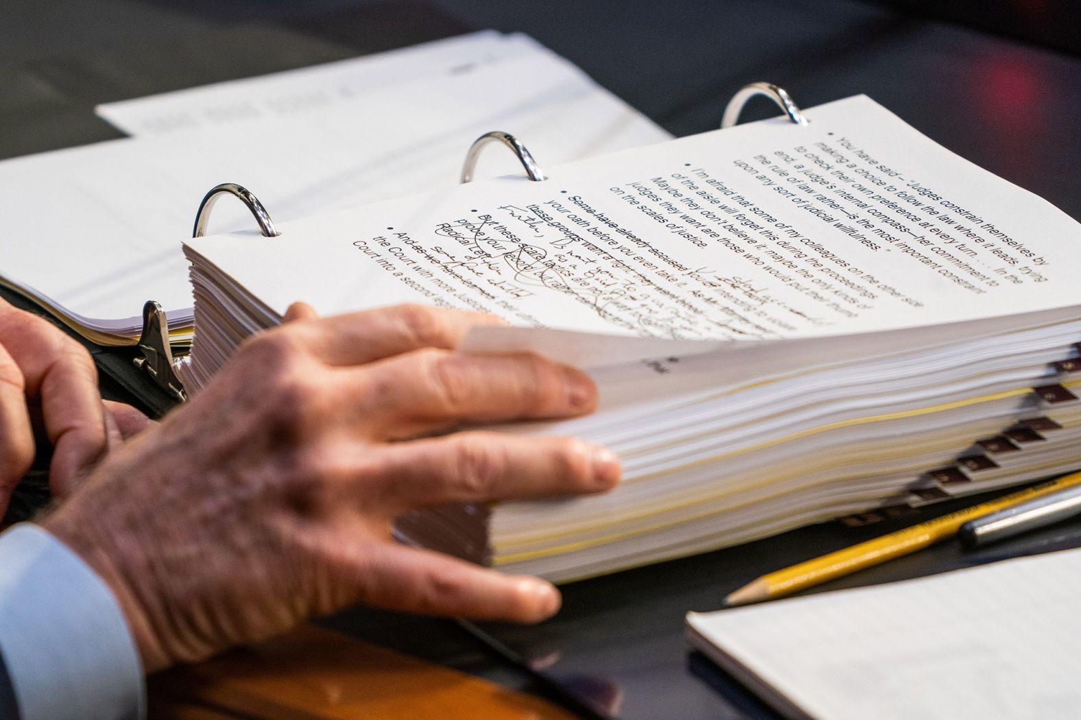 Cornyn looks through his notes on October 12.