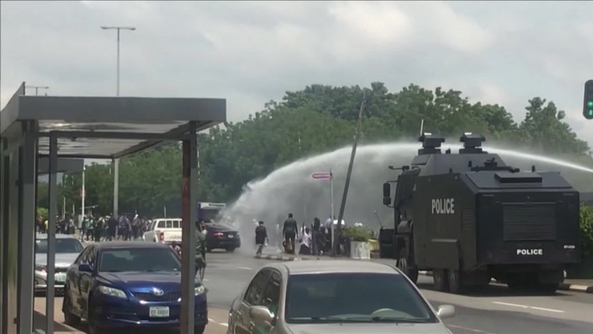 A screenshot of a police truck firing a water cannon at protesters in Nigeria.