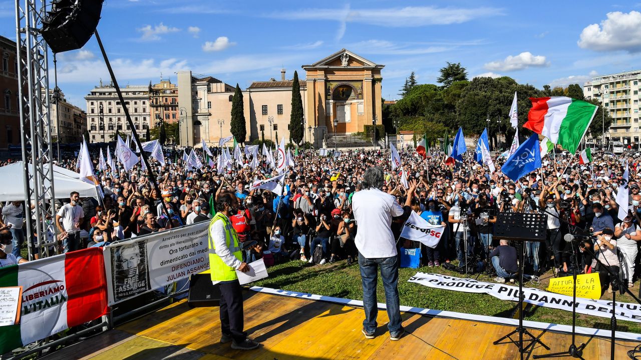 People protest against wearing protective face masks, vaccines, 5G and Italian government's health policy in front of San Giovanni Basilica in Rome on October 10, 2020. (Photo by Andreas SOLARO / AFP) (Photo by ANDREAS SOLARO/AFP via Getty Images)