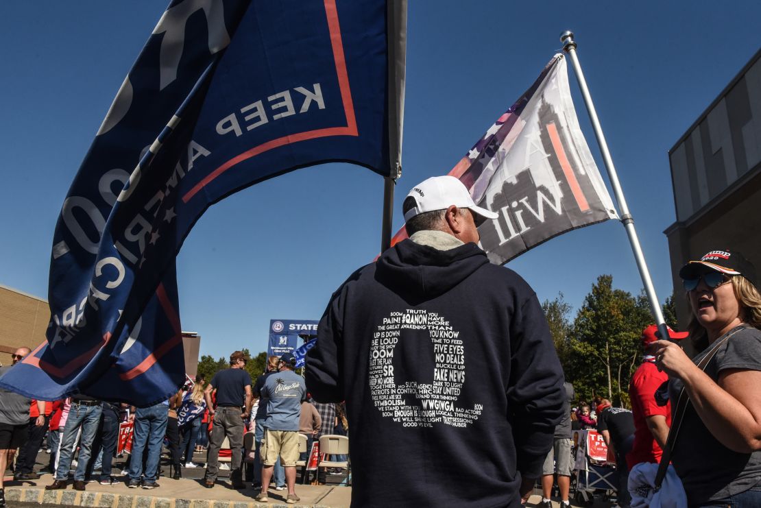 A man wears a QAnon sweatshirt during a pro-Trump rally on October 3, 2020 in the borough of Staten Island in New York City. The event was held to encourage supporters to pray for Trump's health after he contracted Covid-19.