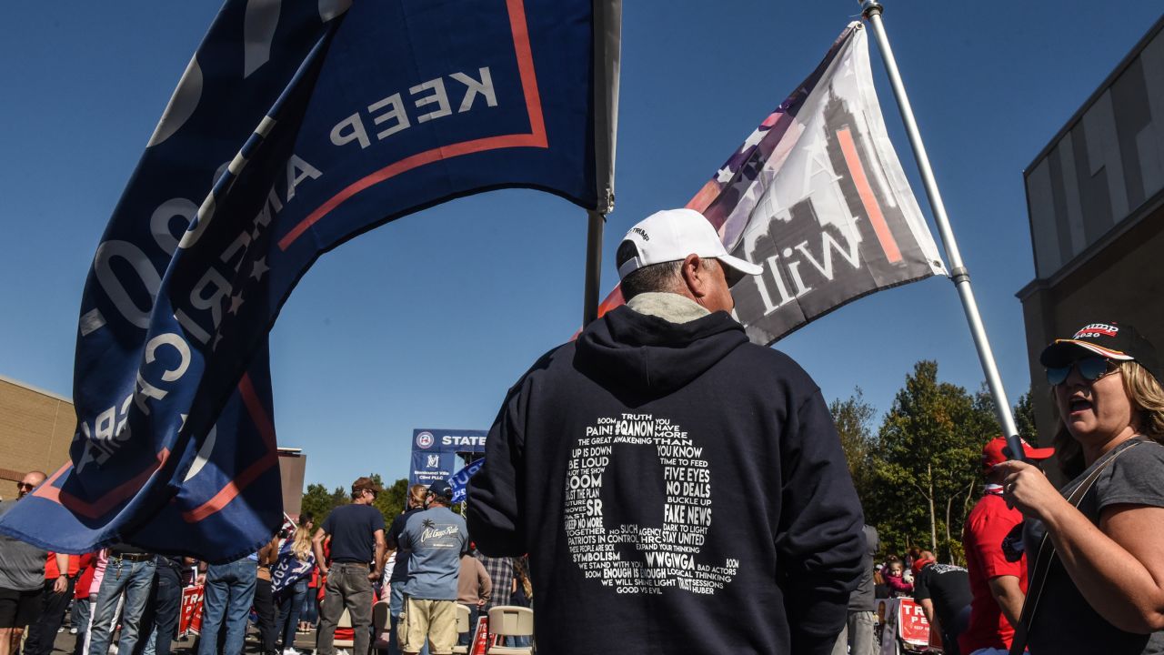 A man wears a QAnon sweatshirt during a pro-Trump rally on October 3, 2020 in the borough of Staten Island in New York City. The event was held to encourage supporters to pray for Trump's health after he contracted Covid-19.