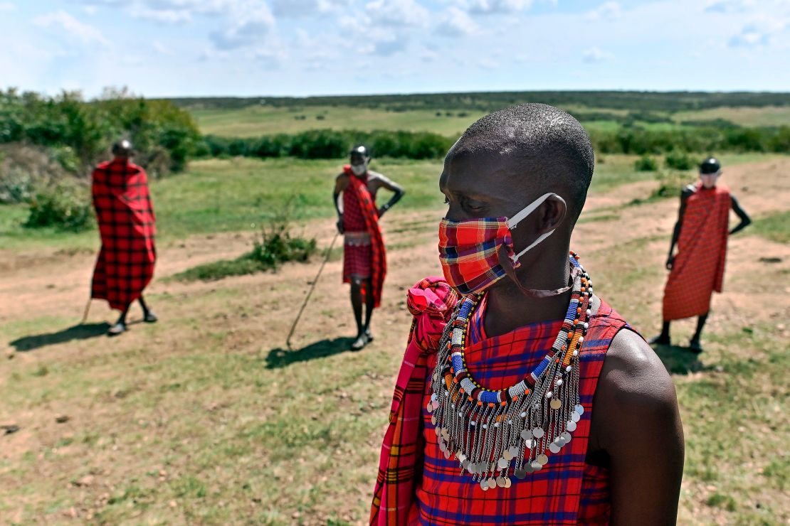 Cultural performers from the Maasai tribe wear masks in the Maasai Mara National Reserve, where their work of performing for visiting tourists has dwindled. 