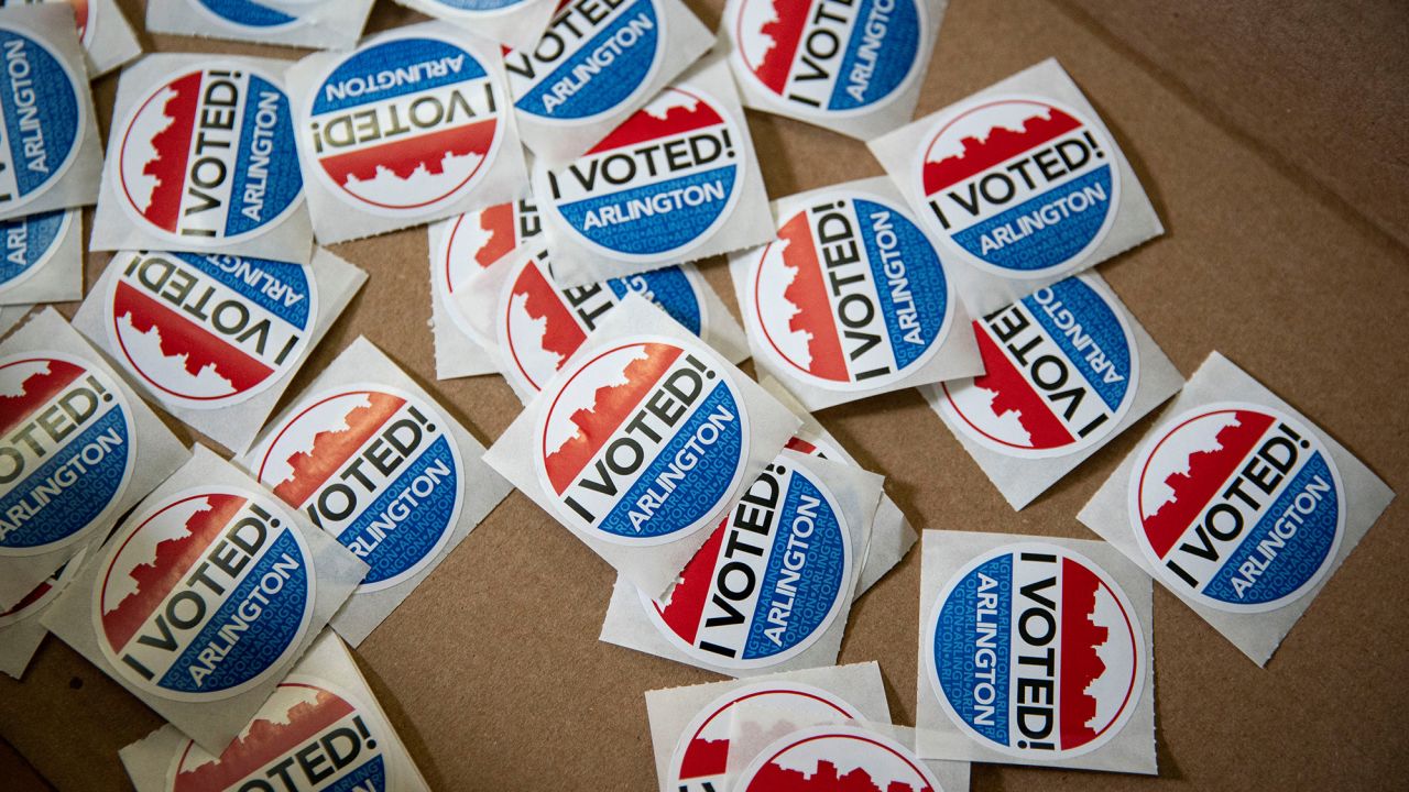 "I Voted" stickers lie in a box for voters after they place their ballots at an early voting site in Arlington, Virginia, U.S., September 18, 2020. REUTERS/Al Drago