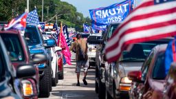 Supporters of President Donald Trump attend a mass caravan named 'Anticommunist Caravan' in Miami, Florida October 10, 2020. Hundreds of cars participated October 10, 2020 in the anticommunist caravan organized by Cuban exiles in Miami.