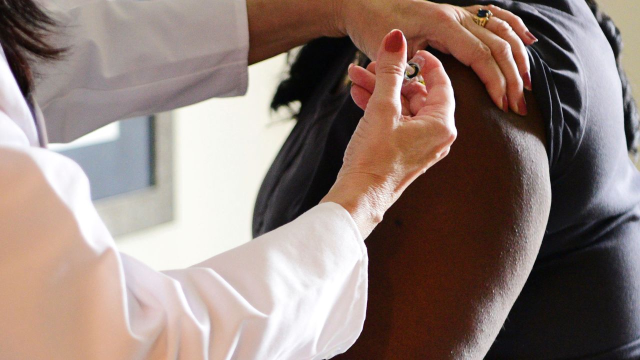 In this undated photo provided by Johnson & Johnson in September 2020, a woman receives an injection during phase 3 testing for the Janssen Pharmaceutical-Johnson & Johnson vaccine in the United States. On Friday, Oct. 2, 2020, a U.S. advisory panel made recommendations for who should be first in line to get COVID-19 vaccine, including a plea for special efforts by states and cities to get the shots to low-income minority groups. (Johnson & Johnson via AP)